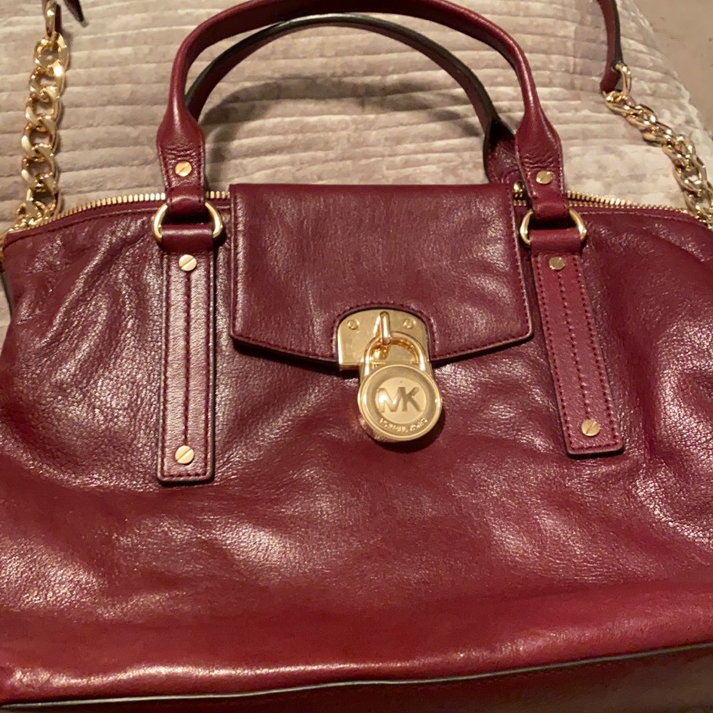 Authentic Michael Kors burgundy handbag with gold chain hardware